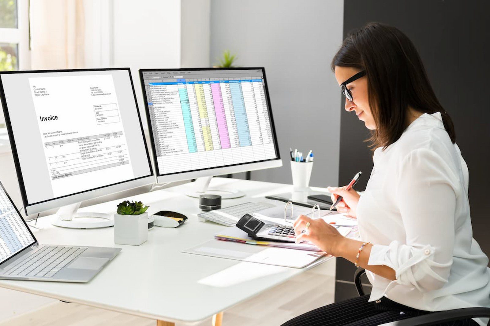 The image shows a medical codes account manager processing medical bills on laptops in an office.